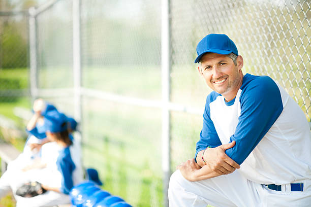 istock Little League Boys Baseball Coach 172484089