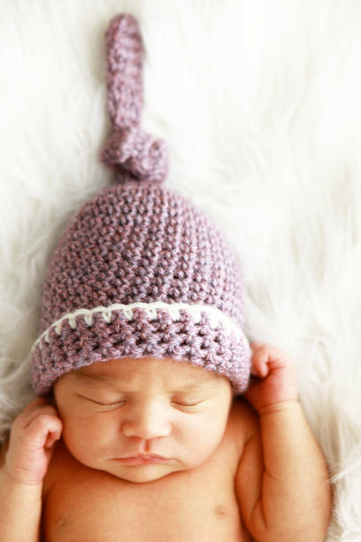 istock Newborn Baby Wearing Knit Hat 172484522
