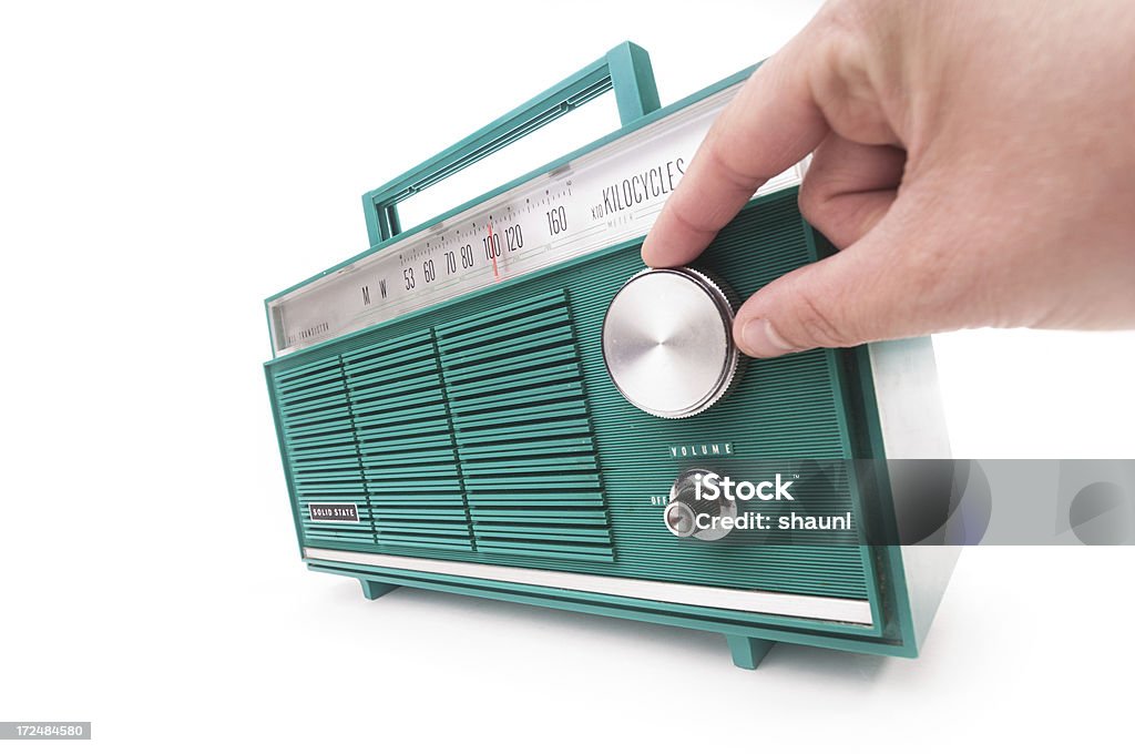 Tuning into Radio Station Tuning into an AM Radio station. Vintage transistor radio. Radio Stock Photo