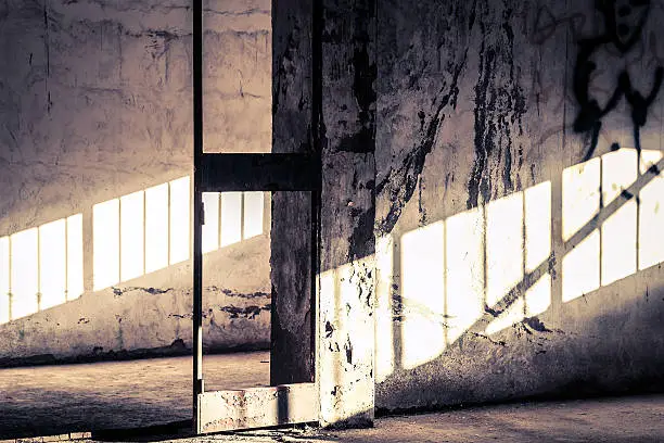 Photo of Sunlight on old wall of abandoned house