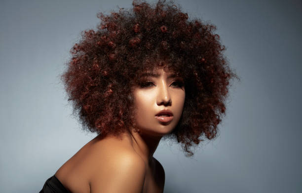 istock Curly-haired mixed-race young woman. 1724850650