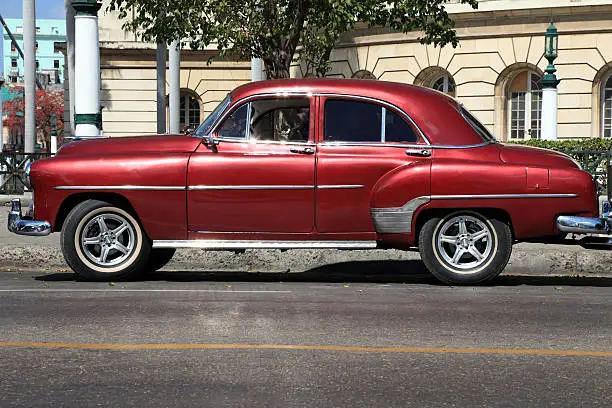 Old classic car parked in the center of Havana, Cuba.