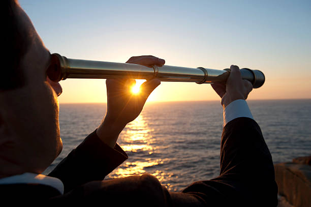 istock Businessman looking to the future with telescope 172485861