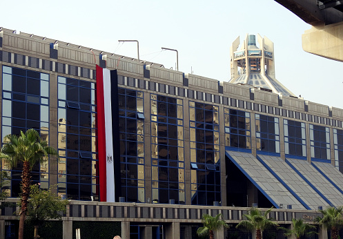 Cairo, Egypt, October 4 2023: the building of ENPPI (Engineering for Petroleum and Process Industries) an international company for petroleum services and petrochemicals, with the Egyptian flag on it, selective focus
