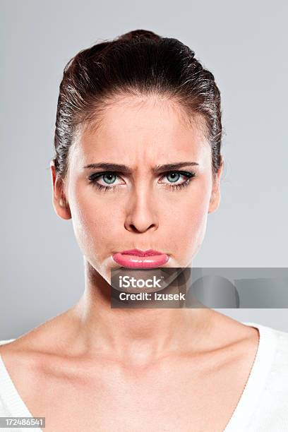 Disappointed Young Woman Studio Portrait Stock Photo - Download Image Now - Portrait, 20-24 Years, Adult