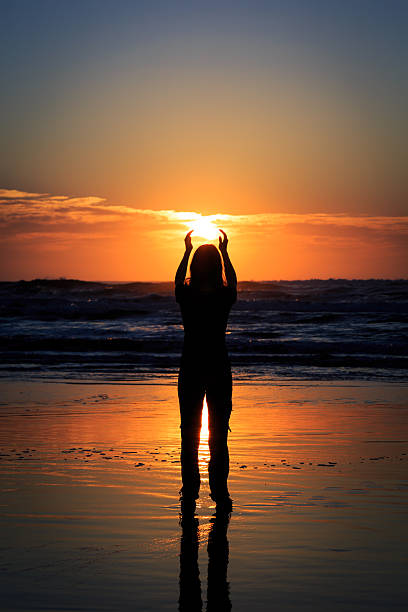 istock Woman Silhouette on a Tropical Beach at Sunrise 172486592