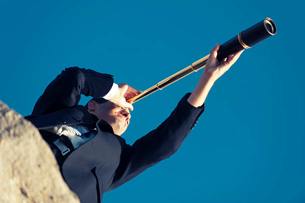 istock Businessman looking to the future with telescope 172486714