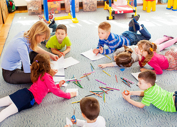 istock Teacher drawing with children. 172486733