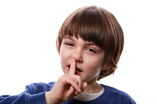 istock Little boy picking a finger up his nose 172487229