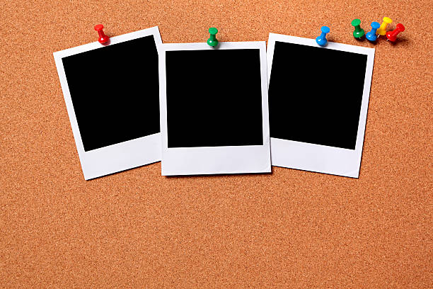 Three blank photos pinned to a cork board Three blank photo prints pinned to a cork notice board.  Space for copy.  Paths provided.   Alternative file shown below: bulletin board photos stock pictures, royalty-free photos & images
