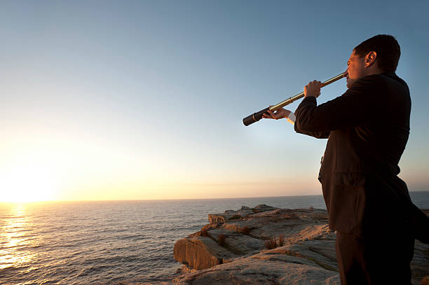 istock Businessman looking to the future with telescope 172487604