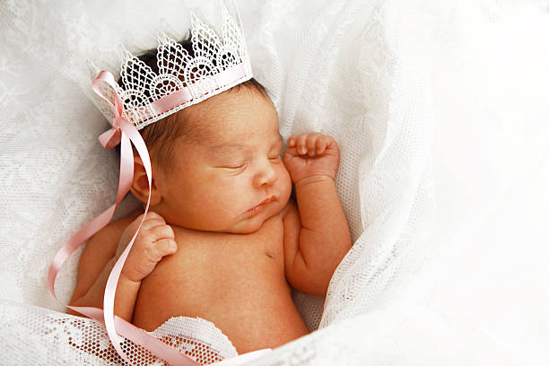 Newborn Baby Girl Wearing Crown stock photo