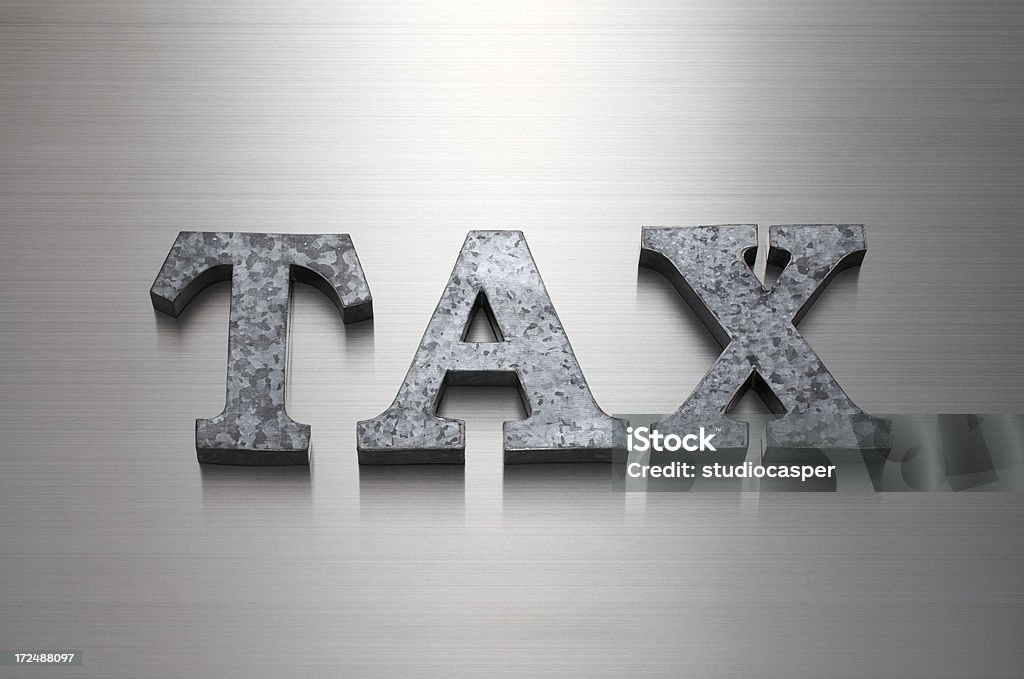 TAX letter TAX on brushed metal Alphabet Stock Photo