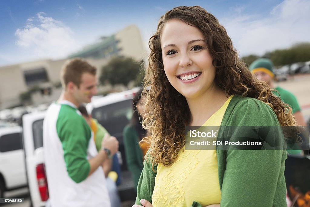 Pretty college girl at football stadium tailgate party Tailgate Party Stock Photo