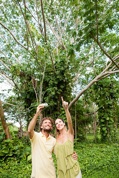 istock Happy tourist couple exploring nature 172488175