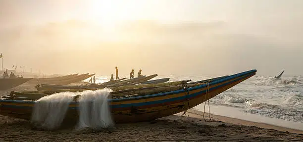 "Fishermen going out to the sea in India. Puri, Orissa, India."
