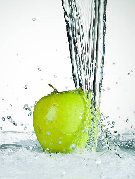 Water Splashing on a Fresh Green Apple