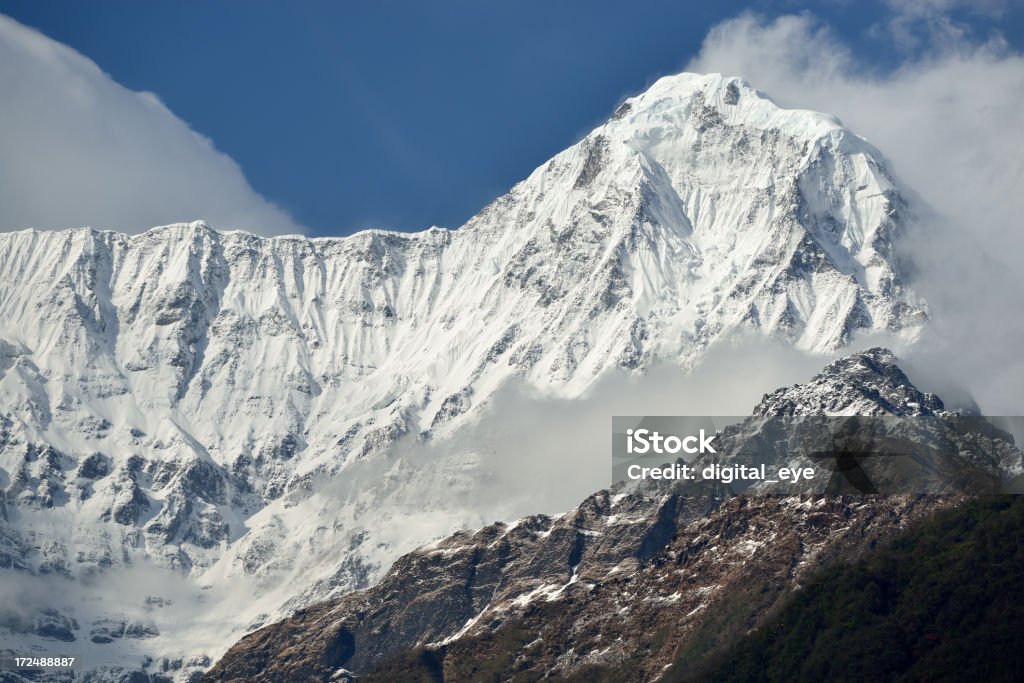 Hiunchuli in Annapurna Himal "The Hiunchuli (6441m) viewed from the village Chhomrong, near Pokhara in Nepal.Taken in the afternoon after some rain.See also my lightbox Himalaya Nepal Tibet" Annapurna Conservation Area Stock Photo