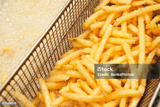 Fast Food French Fries In Restaurant Deep Fryer Stock Photo - Download Image Now - Deep-fryer, French Fries, Restaurant