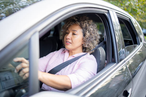 istock Woman is driving a car on her way to work 1724920675