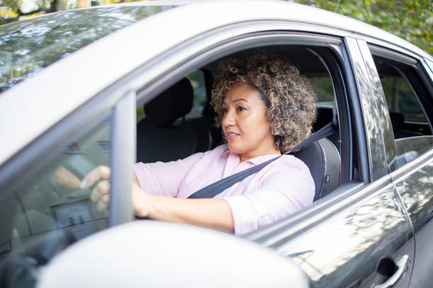istock Woman is driving a car on her way to work 1724920676