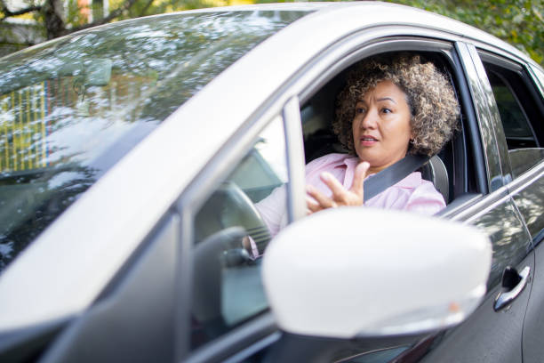 istock Woman is driving a car on her way to work 1724920682