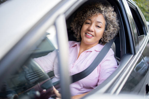 istock Woman is driving a car on her way to work 1724921193