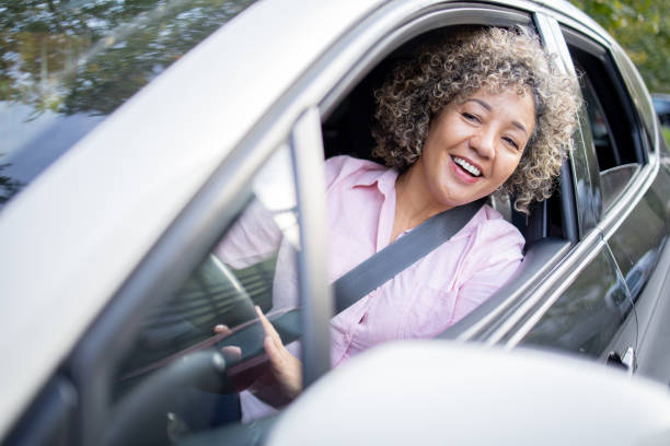 istock Woman is driving a car on her way to work 1724921725