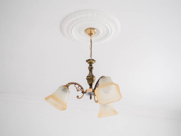 istock Old chandelier on a white ceiling. Room lighting. 1724947075