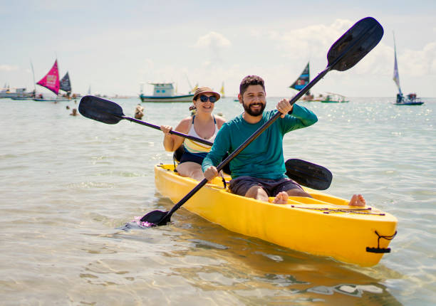 istock Tourist couple kayaking at the beach 1724974278