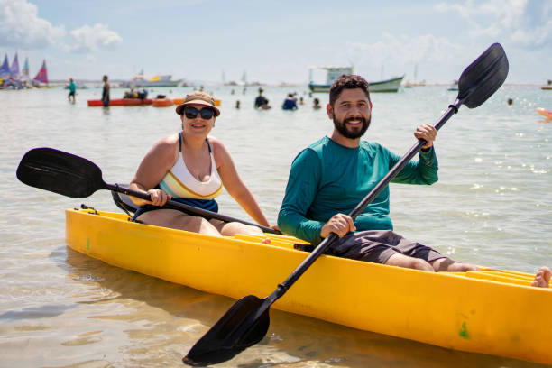 istock Tourist couple kayaking at the beach 1724974396