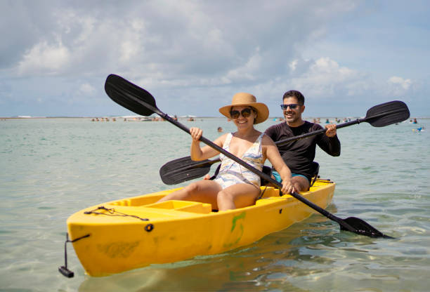 istock Tourist couple kayaking at the beach 1724974799