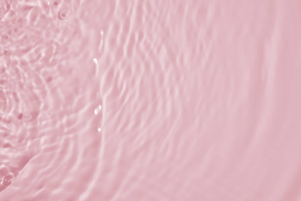 istock Abstract transparent water shadow surface texture natural ripple on pink background 1724978706