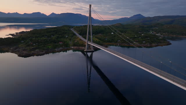 Cinematic aerial footage of an impressive bridge in northern Norway at sunset time, Drone