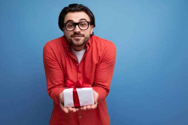 istock cute happy young brunette man got a lovely birthday present 1724995795