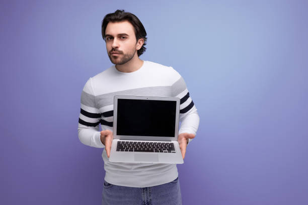 istock charming positive 30s man in red shirt holding laptop screen forward 1724998564