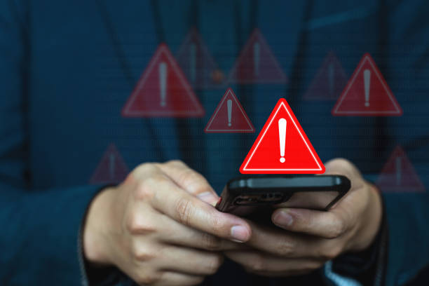 istock Emergency warning alert alarm on Smartphone, Data network protection, Virus alarm. 1725040772