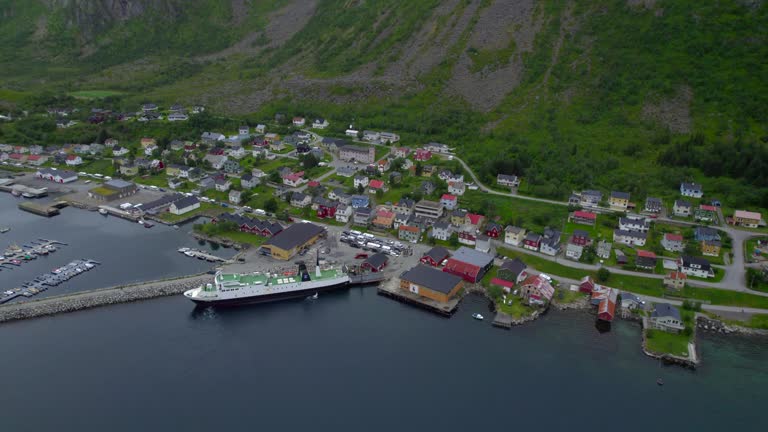 Aerial view of Gryllefjord with a ferry to Andenes, Andøya, with many cars waiting to board the boat but not enough room which causing a traffic jam