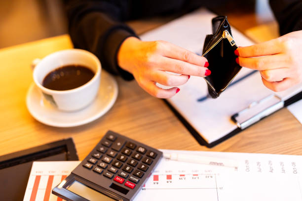 istock Poor woman hand open empty purse looking for money 1725082572