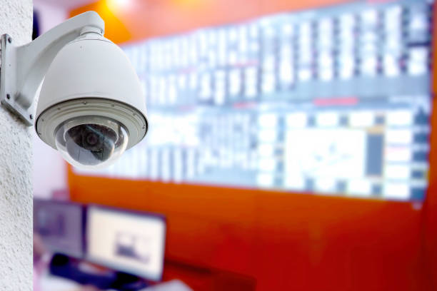 istock Dome CCTV cameras installed on concrete pillars with blurred of  control room. Security room with CCTV cameras in the building. 1725085085