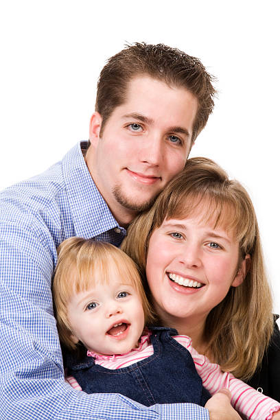 Family of Three on White Portrait of a young family isolated on a white backdrop. mormon woman photos stock pictures, royalty-free photos & images