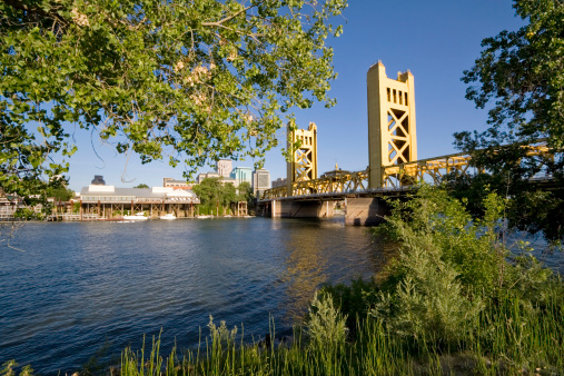 Landmark Tower Bridge (1935) and Old Sacramento waterfront in Sacramento, California at day.  