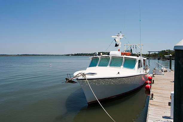 istock Small Trawling boat tied to a dock 172513768
