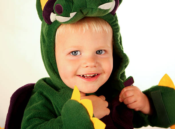 istock Boy putting on his Halloween Costume 172515140