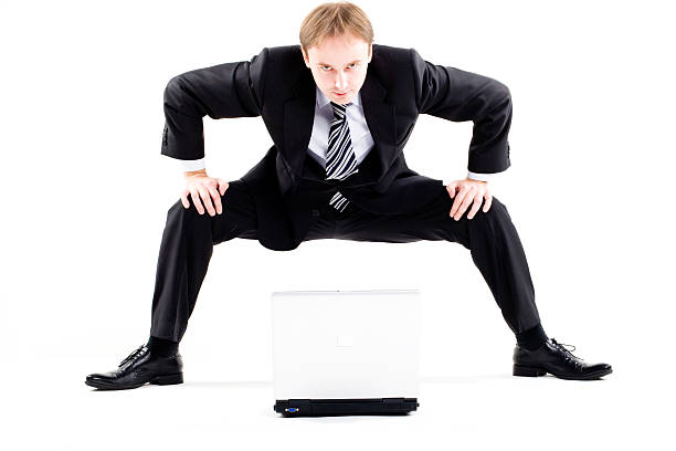 istock sumo-businessman against laptop 172515419