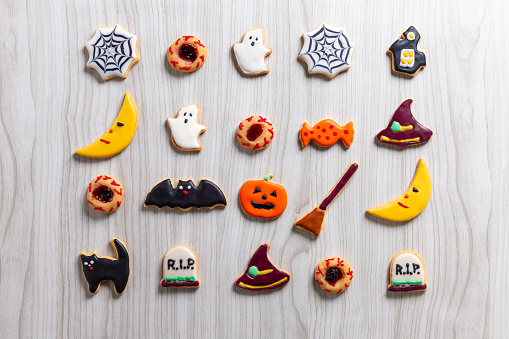 Fresh halloween cookies on white wooden table