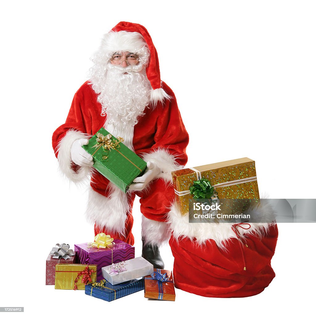Santa avec des cadeaux sur blanc - Photo de Cadeau de Noël libre de droits