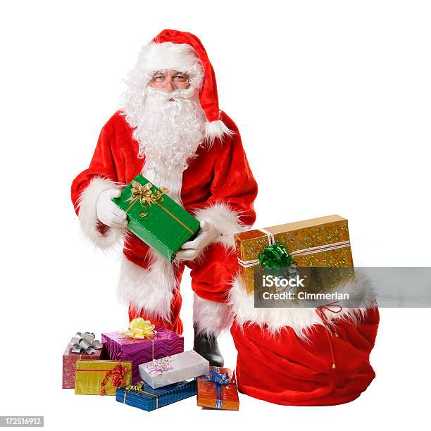 Photo libre de droit de Santa Avec Des Cadeaux Sur Blanc banque d'images et plus d'images libres de droit de Cadeau de Noël - Cadeau de Noël, Sac, Adulte