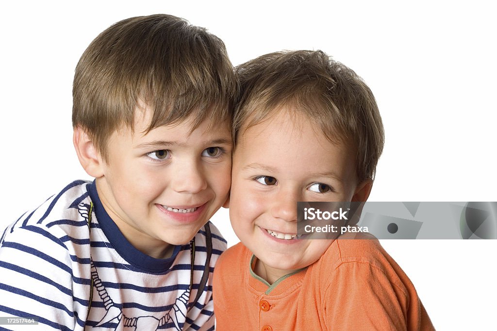 Two happy brothers Two smiling happy brothers portrait. Isolated on white background 2-3 Years Stock Photo