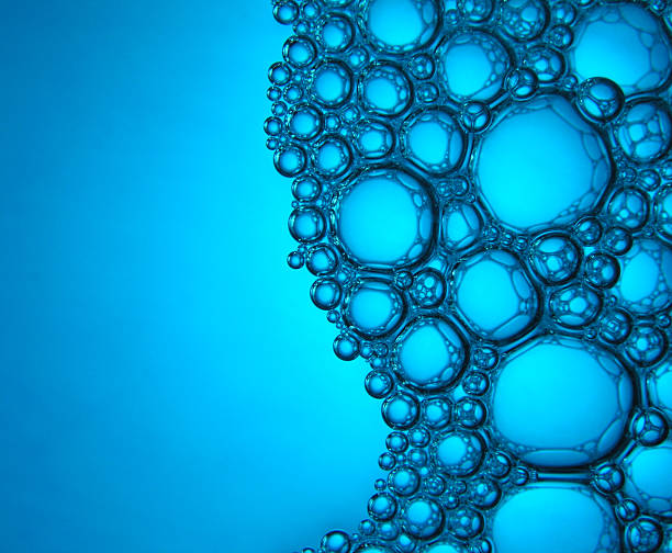 Close-up of blue background with soap and foam pattern stock photo